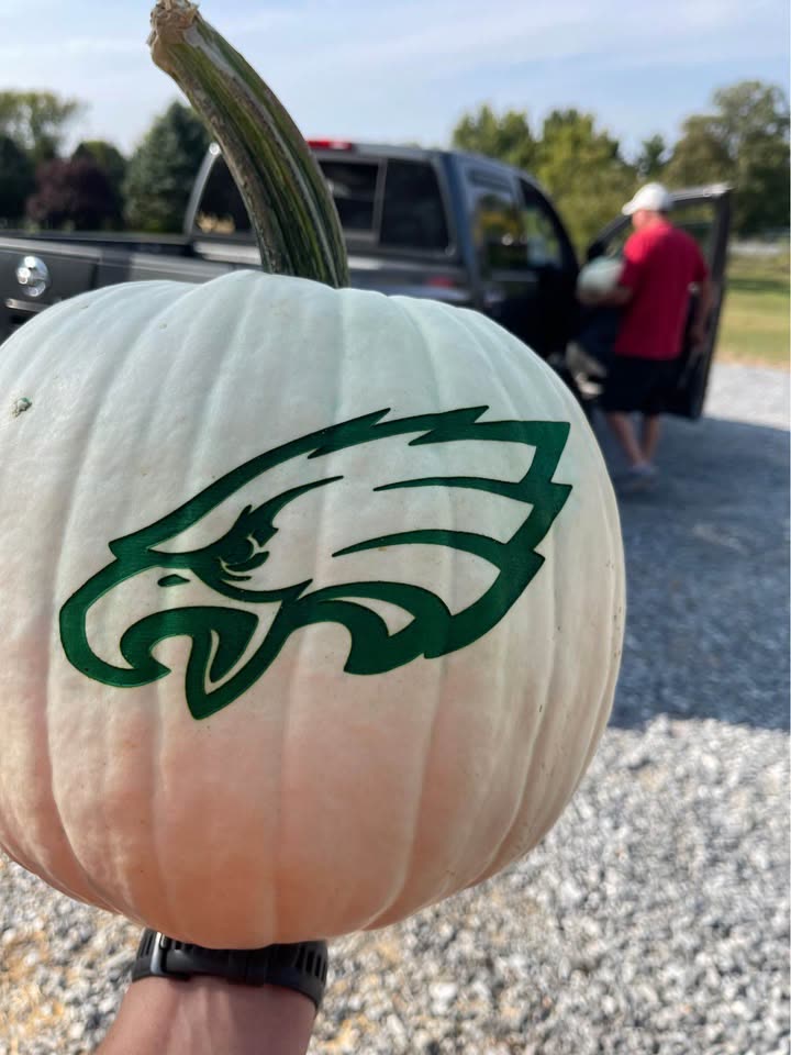 A white pumpkin laser-engraved with the Philadelphia Eagles logo